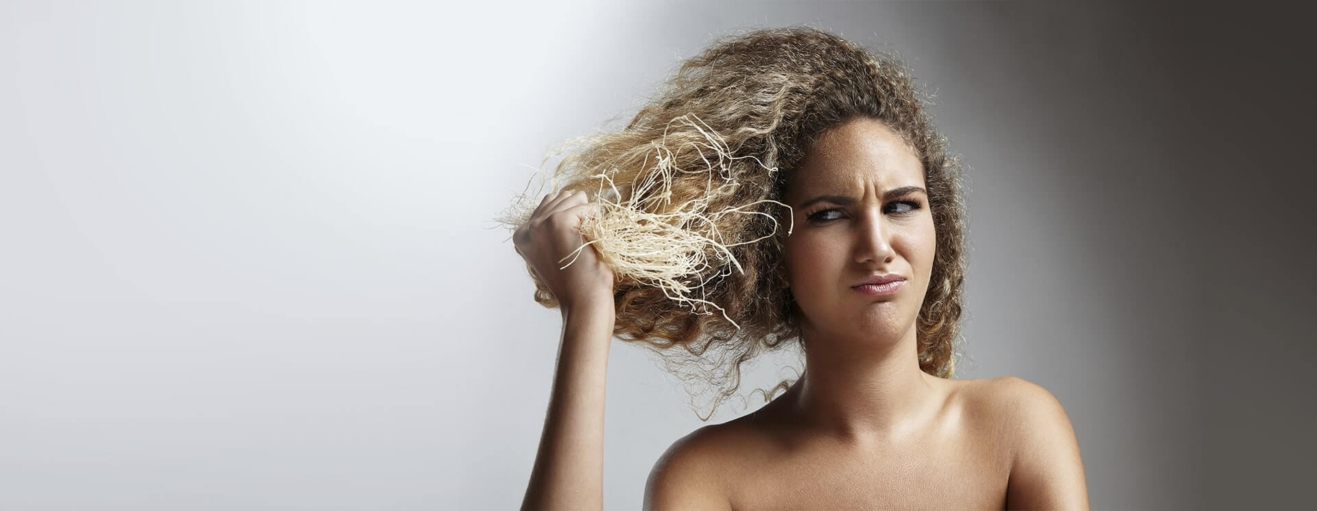 girl irritated by her dry hair