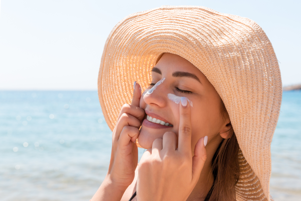 applying sunscreen on beach side