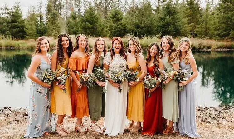 a group of ladies at a wedding with flowers